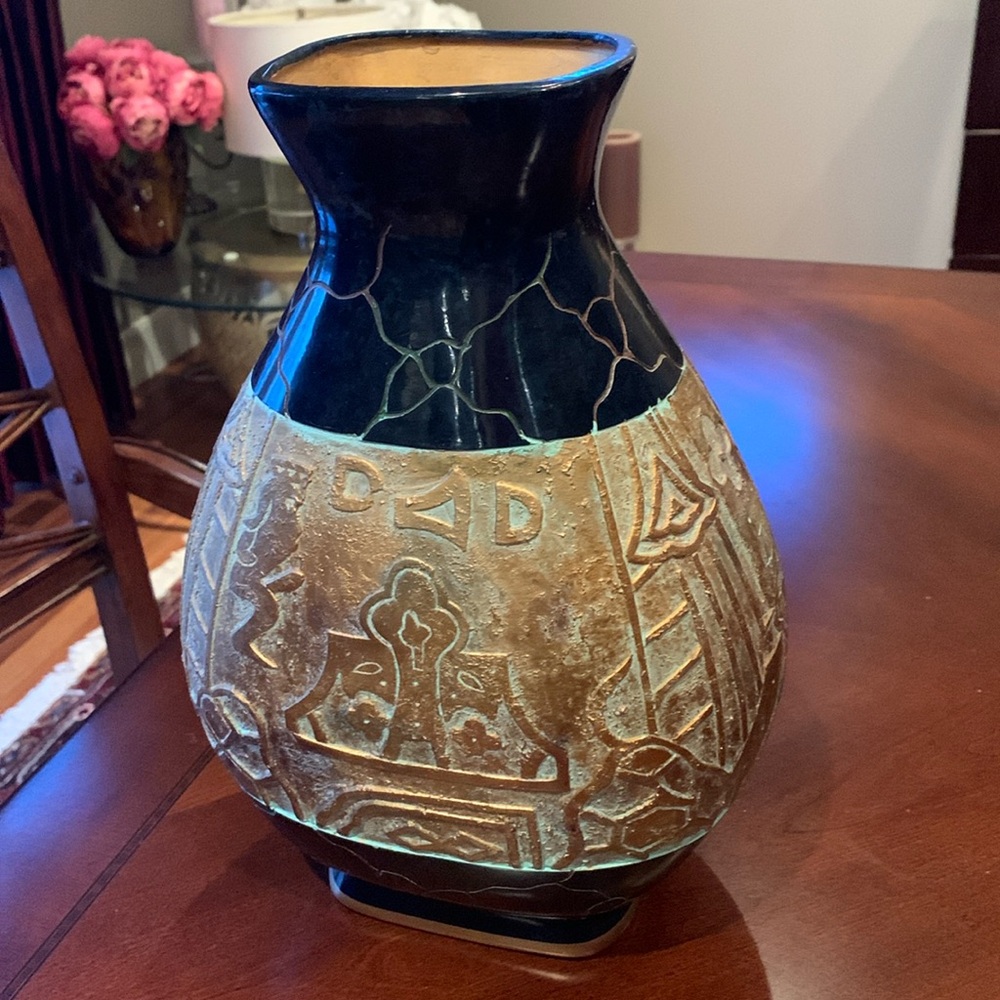 Vase with unique features. 12 inches high  gold textured design.